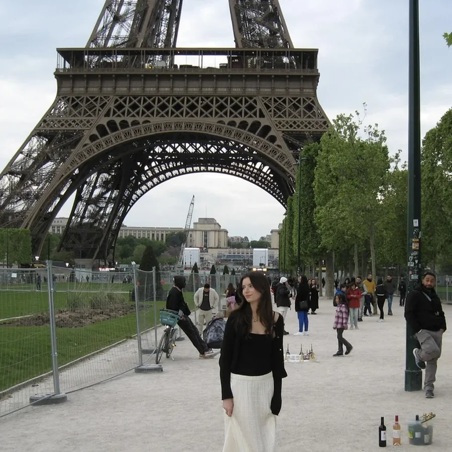 Grace in front of the Eiffel Tower in Paris.