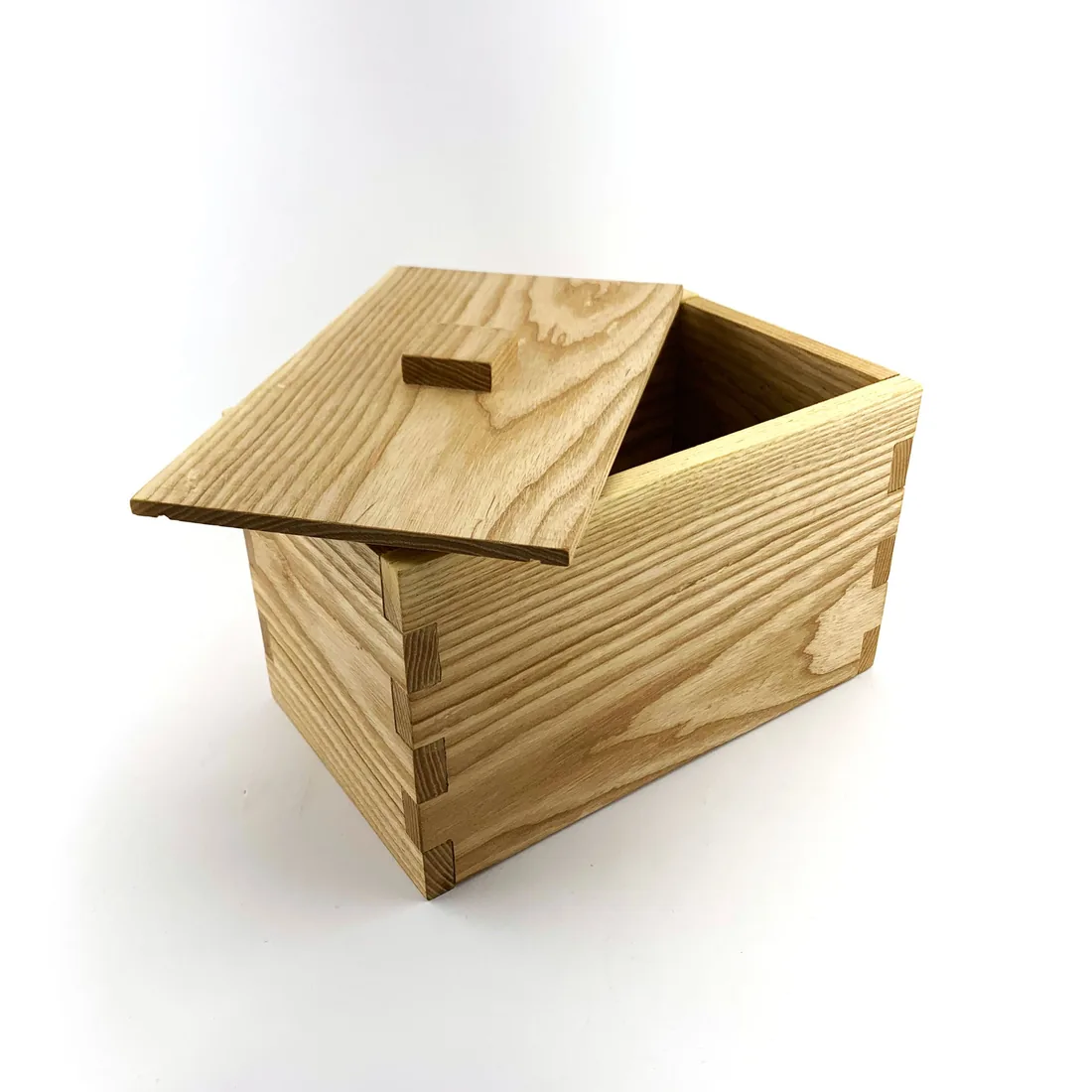A handcrafted ash wood box with finger-jointed corners and a fitted lid.